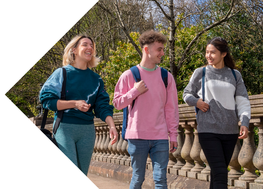 Three young students walking around the University of Glasgow campus.