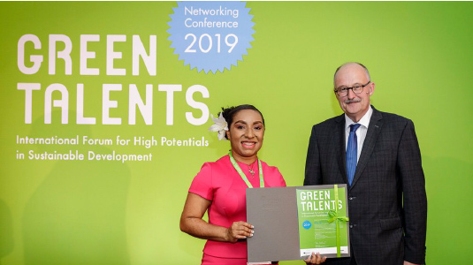 Yalinu Poya receiving her 2019 Green Talents Award for her PhD research into sustainable ammonia synthesis from Dr Michael Meister, Parliament Secretary for the German Government.